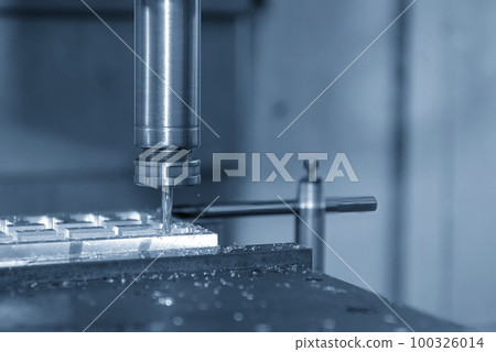 The CNC milling machine rough cutting with flat end mill tool. 100326014