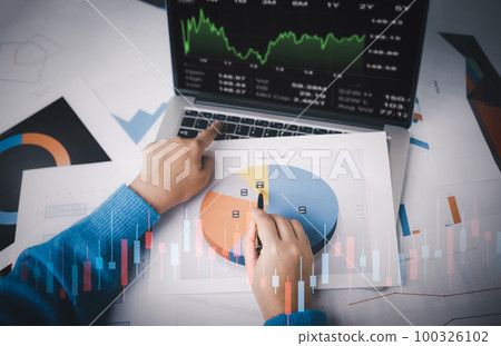 Man using laptop with planning and strategy, Stock market, Business growth down, Concept of financial crisis, echnical price graph and indicator, red candlestick chart with analyzing forex trading. Man using laptop with planning and strategy, Stock market, Business growth down, Concept of financial crisis, echnical price graph and indicator, red candlestick chart with analyzing forex trading. 100326102