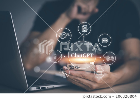 Man using Laptop or Smartphone With ChatGPT Chat with AI, Artificial Intelligence,System Artificial intelligence an artificial intelligence chatbot, Digital chatbot,robot application, conversation 100326804