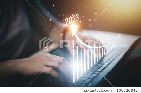 Changes in new planning, Hand using laptop with number 2023 new year, start new year concept digital trends,industry and business trend, strategy, investment, business planning and happy new year 100326842