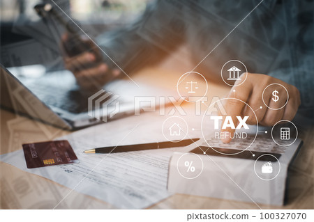 US IRS 1040 form or  US Individual income tax Concept,accountant holding pen working on calculator business with data accounting documents and a laptop, pay tax in 2023 years,new year 2023 tax concept 100327070