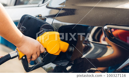 Man Refill and filling Oil Gas Fuel at station. Man Refill and filling Oil Gas Fuel at station. 100327116