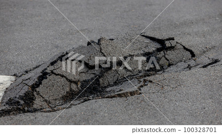 Asphalt road damaged. 100328701