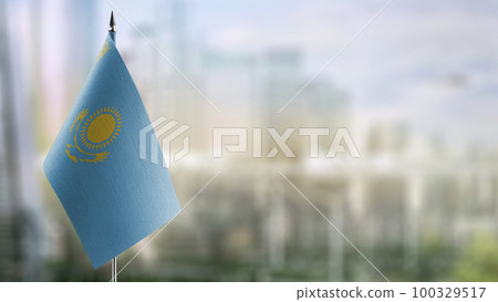A small Kazakhstan flag on an abstract blurry background A small Kazakhstan flag on an abstract blurry background 100329517