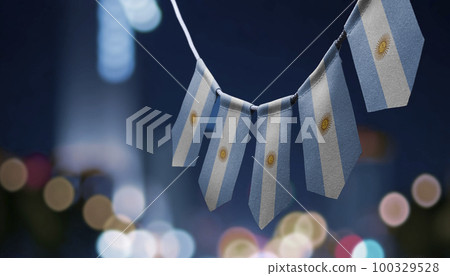 A garland of Argentina national flags on an abstract blurred background 100329528