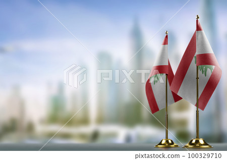 Small flags of the Lebanon on an abstract blurry background 100329710