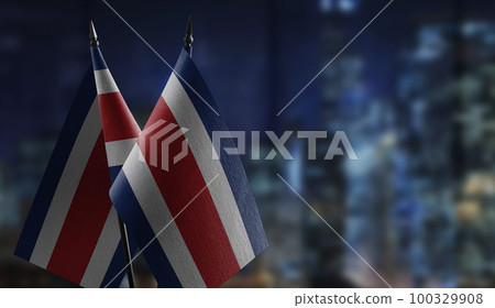Small flags of the Costa Rica on an abstract blurry background Small flags of the Costa Rica on an abstract blurry background 100329908