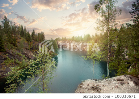 Beautiful view on sunrise, cloudy sky, forest and  mountain river 100330671