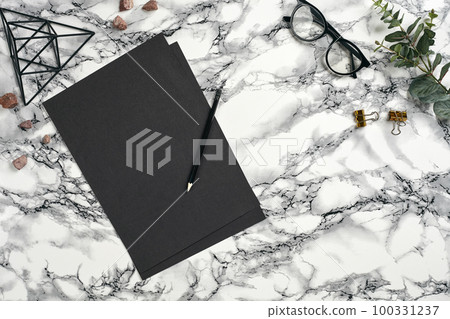 Top view in focus with different office equipment, supplies, stationery. Marble table with copy space. Education, workplace background. Close-up. Top view in focus with different office equipment, supplies, stationery. Marble table with copy space. Education, workplace background. Close-up. 100331237