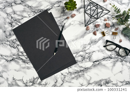 Top view in focus with different office equipment, supplies, stationery. Marble table with copy space. Education, workplace background. Close-up. Top view in focus with different office equipment, supplies, stationery. Marble table with copy space. Education, workplace background. Close-up. 100331241