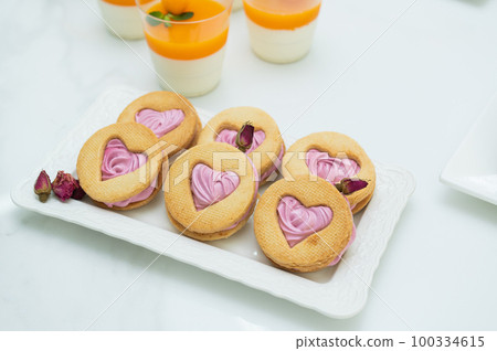 Desserts at the candy bar for valentine's day, shortbread in the shape of a heart 100334615