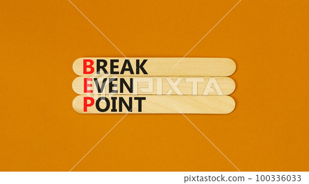 BEP break even point symbol. Concept words BEP break even point on wooden stick on a beautiful orange table orange background. Business and BEP break even point concept. Copy space. BEP break even point symbol. Concept words BEP break even point on wooden stick on a beautiful orange table orange background. Business and BEP break even point concept. Copy space. 100336033