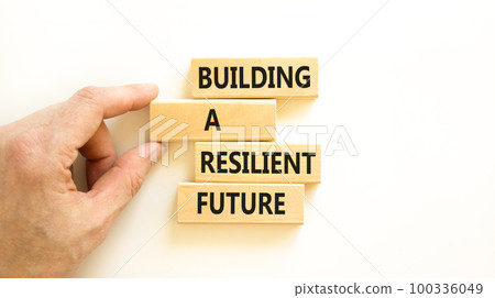 Building a resilient future symbol. Concept word Building a resilient future on wooden blocks. Beautiful white table white background. Business and building a resilient future concept. Copy space. Building a resilient future symbol. Concept word Building a resilient future on wooden blocks. Beautiful white table white background. Business and building a resilient future concept. Copy space. 100336049
