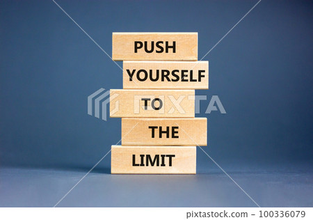 Push the limit symbol. Concept words Push yourself to the limit on wooden blocks. Beautiful grey table grey background. Business push the limit concept. Copy space. Push the limit symbol. Concept words Push yourself to the limit on wooden blocks. Beautiful grey table grey background. Business push the limit concept. Copy space. 100336079