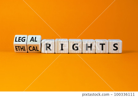 Ethical or legal rights symbol. Turned wooden cubes and changed words ethical rights to legal rights on a beautiful orange background. Business, ethical or legal rights concept. Copy space. Ethical or legal rights symbol. Turned wooden cubes and changed words ethical rights to legal rights on a beautiful orange background. Business, ethical or legal rights concept. Copy space. 100336111