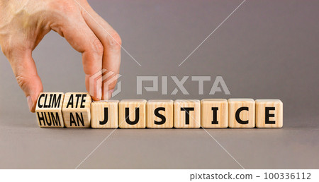 Climate or human justice symbol. Concept words Climate justice Human justice on wooden cubes. Beautiful grey background. Businessman hand. Ecological climate or human justice concept. Copy space. Climate or human justice symbol. Concept words Climate justice Human justice on wooden cubes. Beautiful grey background. Businessman hand. Ecological climate or human justice concept. Copy space. 100336112