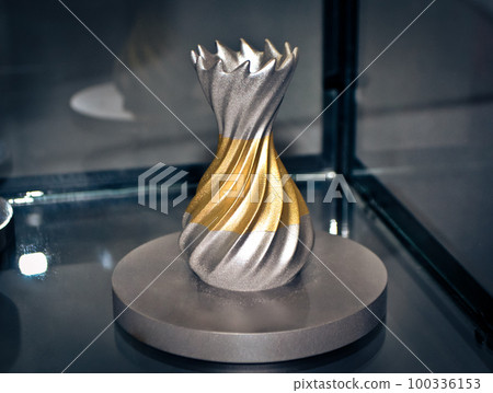 Object printed on metal 3d printer close-up. Object printed in laser sintering machine. Modern 3D printer printing from metal powder. Concept progressive additive DMLS, SLM, SLS 3d printing technology 100336153