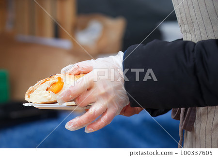 Selling apricot puff pastry cheesecake at a farmers market. Selling apricot puff pastry cheesecake at a farmers market. 100337605