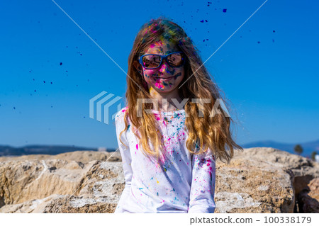 Young european girl celebrating holy festival on a blue sky background 100338179