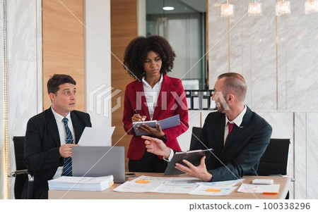 Diverse business team discussing project at corporate briefing in boardroom. colleagues meeting for brainstorming, sharing ideas, together. Teamwork concept Diverse business team discussing project at corporate briefing in boardroom. colleagues meeting for brainstorming, sharing ideas, together. Teamwork concept 100338296