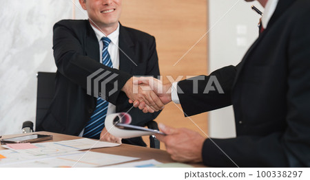 Business handshake for teamwork of business merger and acquisition, successful negotiate, businessman shake hand with partner to celebration partnership and business deal concept 100338297