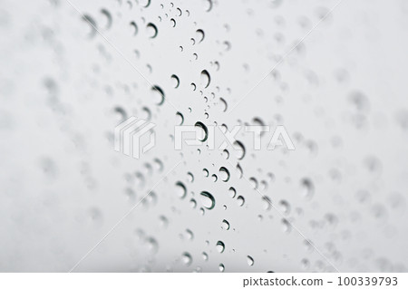 Raindrop attached to window glass Raindrop attached to window glass 100339793