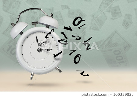 Time is running out. White alarm clock with flying numbers as a symbol of lost time. Time is running out, time is investing, the alarm clock with numbers is shattering into small pieces. 100339823