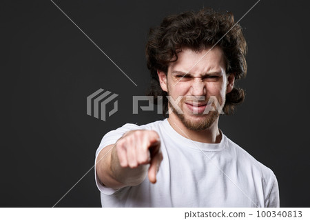 amazed caucasian man pointing finger at you 100340813