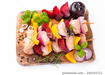 Raw chicken meat skewers with vegetables,plums,yellow pepper,onions,with spices,herbs white background.Uncooked meat skewer.Skewers with pieces of raw meat.Top view.Chicken Skewers breast fillet meat. Raw chicken meat skewers with vegetables,plums,yellow pepper,onions,with spices,herbs white background.Uncooked meat skewer.Skewers with pieces of raw meat.Top view.Chicken Skewers breast fillet meat. 100343721