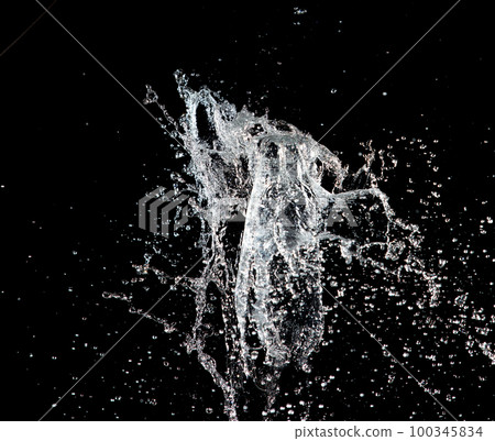 Water hit wall ground, explode into drop droplet. Amount Water attack impact and fluttering in air explosion. Stop motion freeze shot. Splash Water for texture elements, black background isolated 100345834