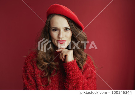 happy elegant woman in red sweater and beret on red background happy elegant woman in red sweater and beret on red background 100346344