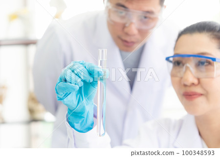 Close up hand scientists study cell health care and researchers Close up hand scientists study cell health care and researchers 100348593