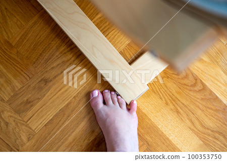 Woman hit furniture with the little toe. Incident at home. Injury of foot little finger Woman hit furniture with the little toe. Incident at home. Injury of foot little finger 100353750