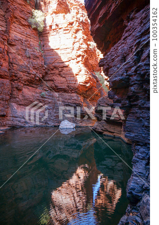 Rainwater accumulating in the valleys of Karijini National Park Rainwater accumulating in the valleys of Karijini National Park 100354162