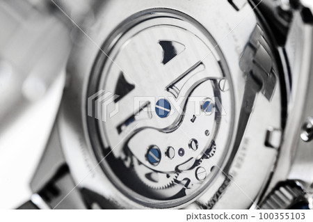 Movement of automatic mechanical wrist watch, macro photo 100355103