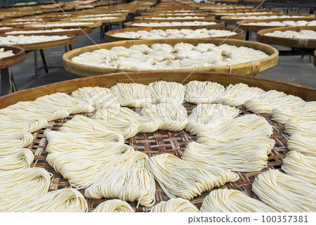 Close-up of traditional handmade noodle-making drying outdoors in Guanmiao, Tainan, Taiwan. Close-up of traditional handmade noodle-making drying outdoors in Guanmiao, Tainan, Taiwan. 100357381