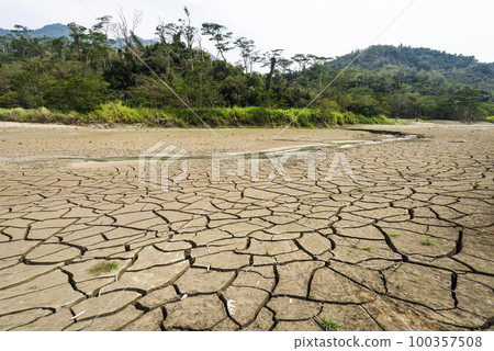 Dry lake bed with the natural texture of cracked clay on the perspective land. Dry lake bed with the natural texture of cracked clay on the perspective land. 100357508