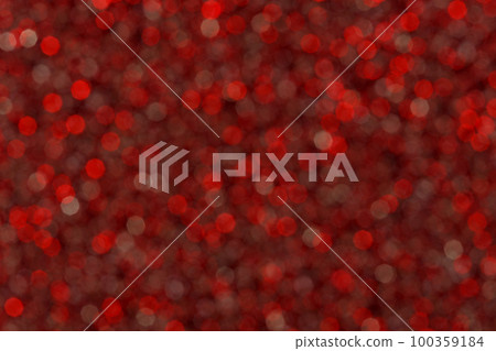 Abstract red blured glitter lights background. Circle blurred bright bokeh texture. Romantic backdrop for Christmas, new year, xmas, Valentines day, womens day, holiday or event. 100359184