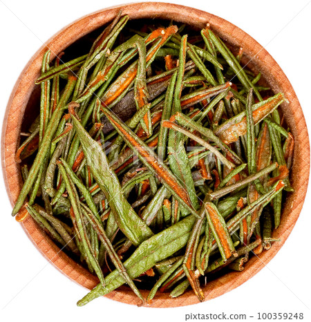 Marsh or Northern Labrador Tea, Ledum palustre in a small wooden bow isolated on white. 100359248