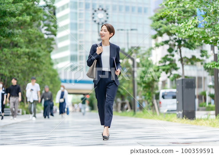 Business image woman walking Business image woman walking 100359591