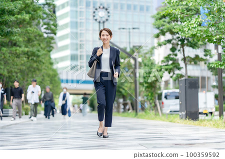 Business image woman walking Business image woman walking 100359592