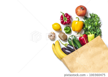 Eco friendly paper shop bag with raw organic green vegetables isolated on white background Flat lay, top view Zero waste, plastic free concept Healthy clean eating diet and detox, agriculture concept. 100360475
