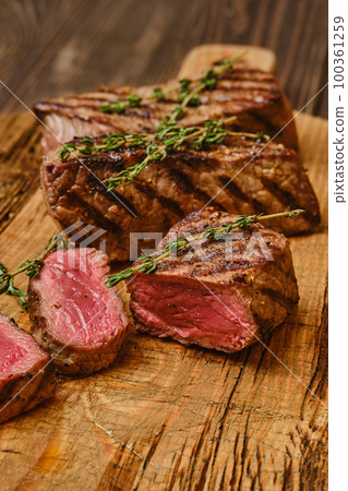Closeup view of medium rare beef steak Closeup view of medium rare beef steak 100361259
