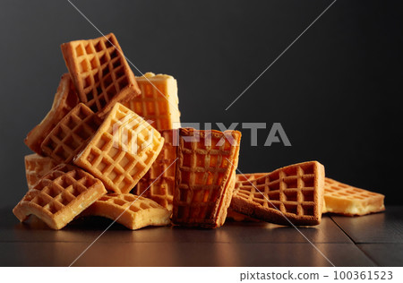 Belgian waffles on a black background. Belgian waffles on a black background. 100361523