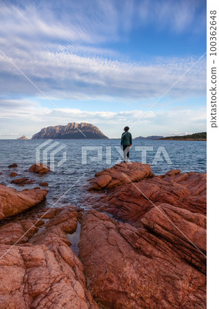 Rocky and Sandy Beach in Porto Istana, Sardinia, Italy. Tavolara Island in Background. Rocky and Sandy Beach in Porto Istana, Sardinia, Italy. Tavolara Island in Background. 100362648