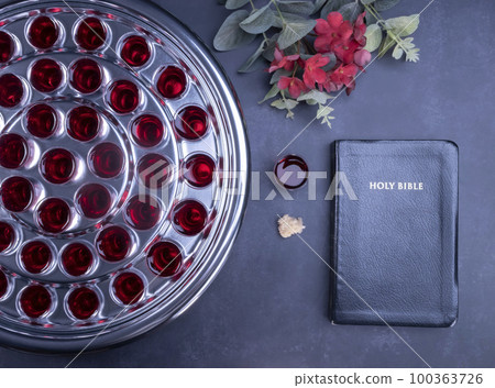 Taking communion the wine and the bread symbols on black background 100363726