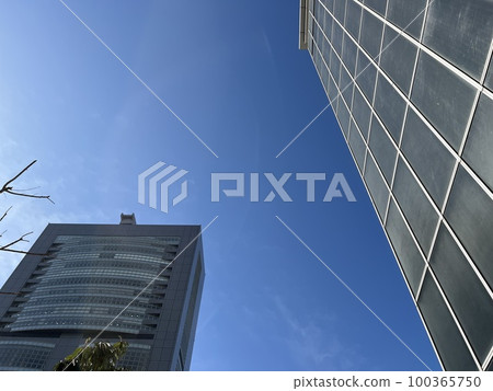 Urban business district buildings and blue sky 100365750