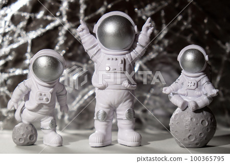 Three Plastic toys figure astronaut on silver background Copy space. Concept of out of earth travel, private spaceman commercial flights missions and Sustainability Three Plastic toys figure astronaut on silver background Copy space. Concept of out of earth travel, private spaceman commercial flights missions and Sustainability 100365795