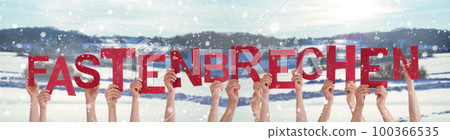 People Hands Holding Word Fastenbrechen Means Fast-Breaking, Winter Background People Hands Holding Word Fastenbrechen Means Fast-Breaking, Winter Background 100366535