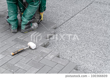 construction of a sidewalk from concrete blocks construction of a sidewalk from concrete blocks 100366609